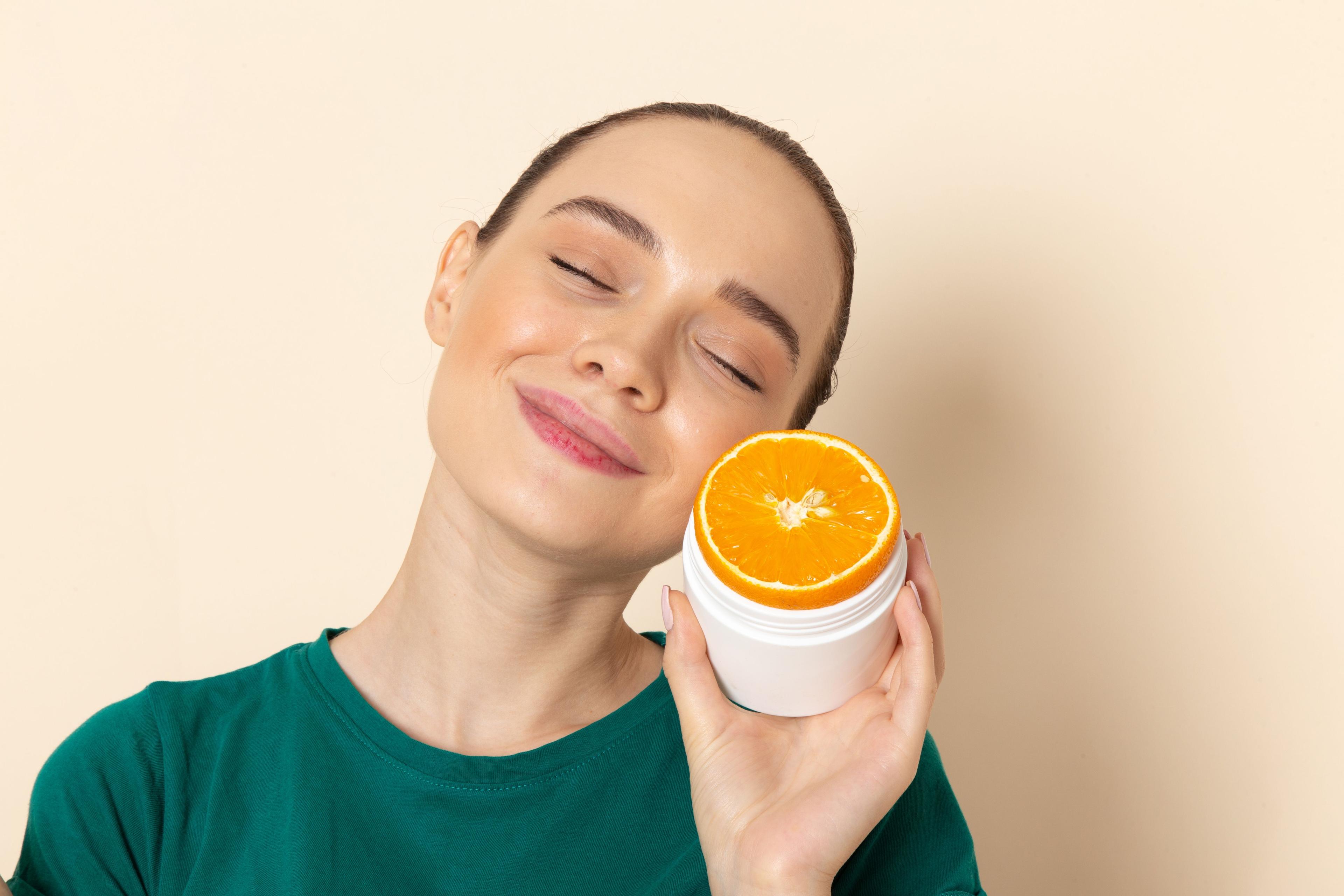 Vitamin C serum being applied to skin to help fade acne scars and post-acne dark spots